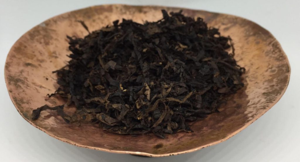 The distinct dark color of Latakia tobacco leaves